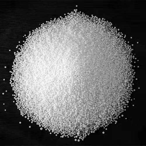 White urea prills on a dark background — automotive grade urea